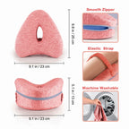 Pink ergonomic knee pillow measuring 25 by 23 by 13 cm featuring a smooth zipper and machine washable cover