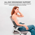 Woman sitting in an office chair using the Charcoal Grey lumbar cushion, demonstrating natural spinal alignment and all-day support by Marnify